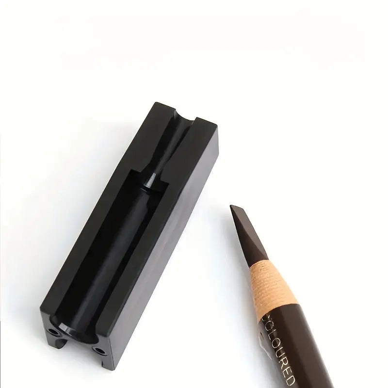 A black professional pencil sharpener next to a pencil tip, on a white background.